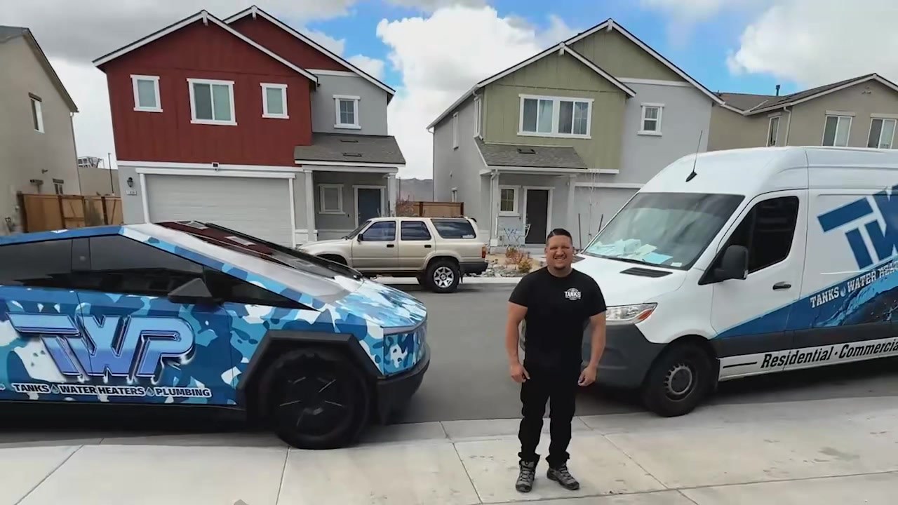 Adan Lopez of Tanks Water Heaters & Plumbing with the TWP-wrapped Cybertruck and Sprinter van